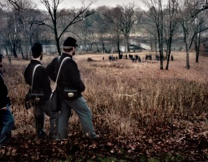 Union re-enactors watch as a pontoon bridge across the Rappahannock is readied during a reenactment of the Battle of Fredericksburg, VA. 2012