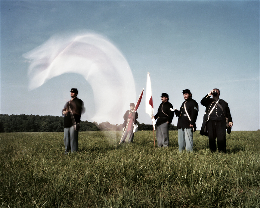 Signal flag in motion as re-enactors send messages during a battle reenactment near Gettysburg, Pa. 2012