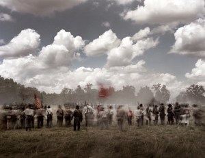 Confederate troops on the attack during a reenactment of the Battle of Gettysburg. 2013