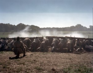 Confederate reenactors fight from behind earthworks in Henrico, Va 2014