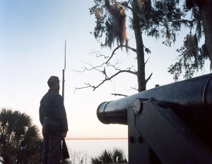 Reenactor stands sentry at Fort McAllister looking to the opposite bank of the Ogeechee River where the Union Navy anchored their ironclads to bombard the in 1863