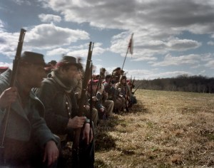 Confederate reenactors wait for the Union attack